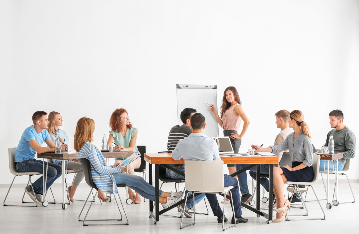 Group of People with Business Trainer at Seminar